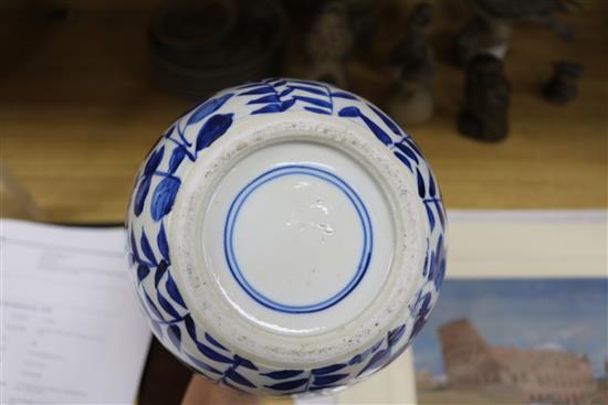 A Chinese blue and white jar, with hardwood cover height 22cm